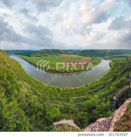Top evening view of the Dnister river bend canyon, with spring fields on coast. Ternopil region, Ukraine, Europe. Top evening view of the Dnister river bend canyon, with spring fields on coast. Ternopil region, Ukraine, Europe. 101783507
