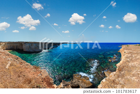 Grottoes on Spiaggia Massolivieri beach. Summer sea landscape (Siracusa, Sicily, Italy). Grottoes on Spiaggia Massolivieri beach. Summer sea landscape (Siracusa, Sicily, Italy). 101783617