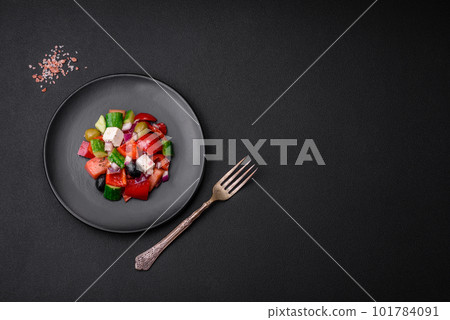 Delicious, fresh Greek salad with feta cheese, olives, tomatoes and cucumbers Delicious, fresh Greek salad with feta cheese, olives, tomatoes and cucumbers 101784091