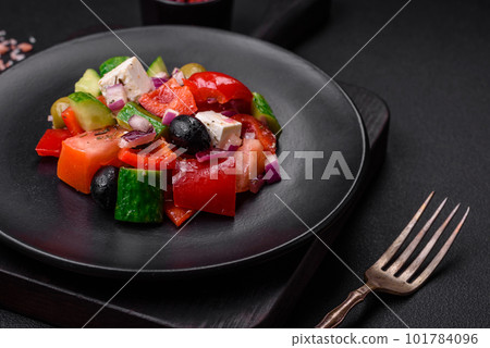 Delicious, fresh Greek salad with feta cheese, olives, tomatoes and cucumbers Delicious, fresh Greek salad with feta cheese, olives, tomatoes and cucumbers 101784096