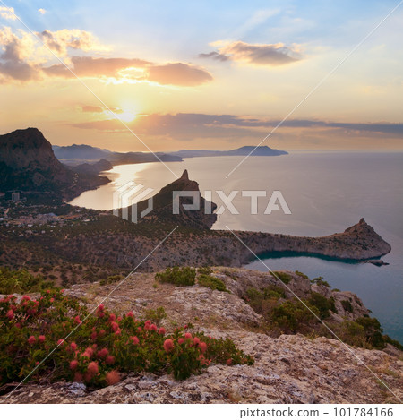 Evening coastline of Novyj Svit reserve, Crimea, Ukraine, Capchik Cape on background. Evening coastline of Novyj Svit reserve, Crimea, Ukraine, Capchik Cape on background. 101784166