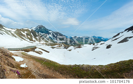 Summer (June) Alps mountain and winding road (view from Grossglockner High Alpine Road). Summer (June) Alps mountain and winding road (view from Grossglockner High Alpine Road). 101784176