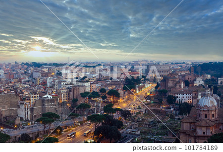 Ruins of Roman Forum. Rome City evening view from II Vittoriano top. People are unrecognizable. 101784189