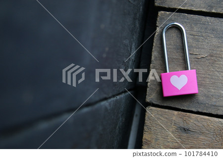 Pink padlock with a heart. Romantic background. 101784410