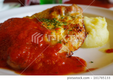 Chicken Milanese with plenty of sauce Chicken Milanese with plenty of sauce 101785133