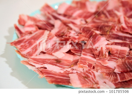 plate with sliced serrano jamon 101785506