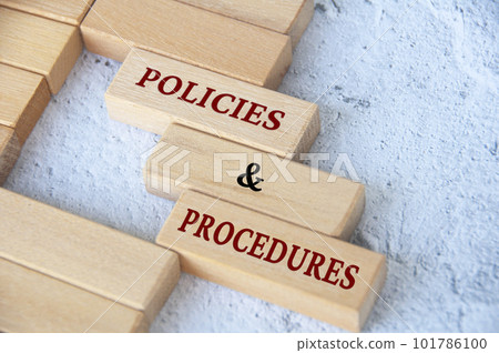 Top view of policies and procedures on wooden blocks. Policies and procedures concept. 101786100