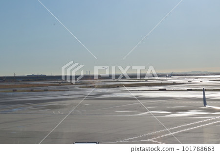 An airplane that moves with great care after the rain 101788663