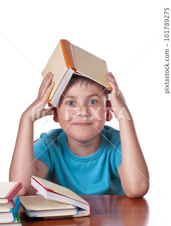 Child and books. The boy reads and plays with books. Delight on the face of the child from the books read. A preschooler is learning to read. Portrait of a boy on a white background Child and books. The boy reads and plays with books. Delight on the face of the child from the books read. A preschooler is learning to read. Portrait of a boy on a white background 101789275