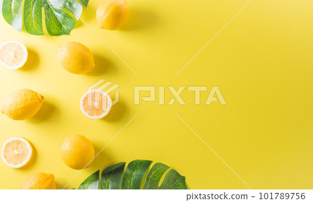 Summer composition made from oranges, lemon or lime on pastel yellow background. Fruit minimal concept. Flat lay, top view, copy space. 101789756