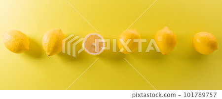 Summer composition made from oranges, lemon or lime on pastel yellow background. Fruit minimal concept. Flat lay, top view, copy space. 101789757