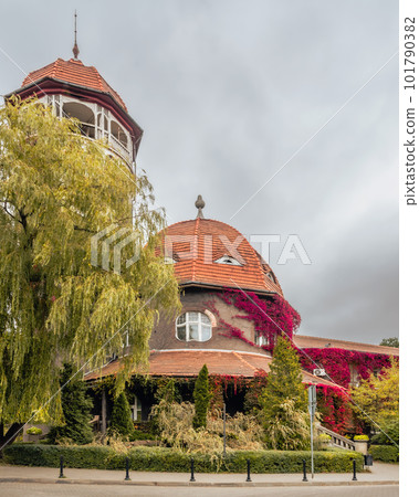 Entrance to Water tower and adjoining rotundal building of the water and mud baths at autumn. Svetlogorsk. Russia Entrance to Water tower and adjoining rotundal building of the water and mud baths at autumn. Svetlogorsk. Russia 101790382