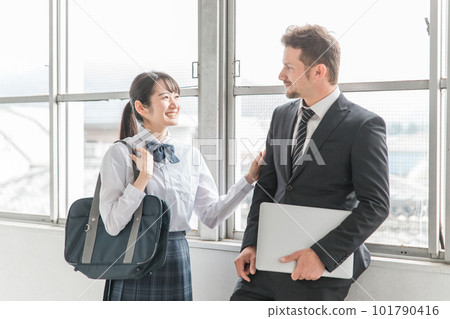 High school girls, high school students, junior high school students talking with school teachers High school girls, high school students, junior high school students talking with school teachers 101790416