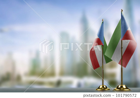 Small flags of the Equatorial Guinea on an abstract blurry background 101790572