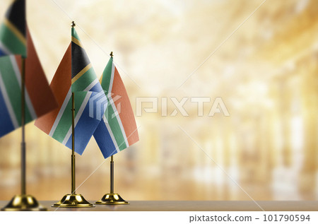 Small flags of the South Africa on an abstract blurry background Small flags of the South Africa on an abstract blurry background 101790594