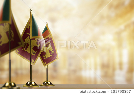 Small flags of the Sri Lanka on an abstract blurry background Small flags of the Sri Lanka on an abstract blurry background 101790597