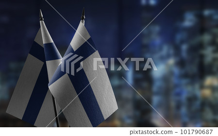 Small flags of the Finland on an abstract blurry background Small flags of the Finland on an abstract blurry background 101790687