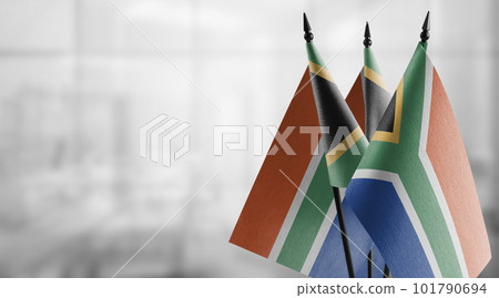 Small flags of the South Africa on an abstract blurry background 101790694