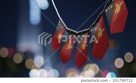 A garland of Papua New Guinea national flags on an abstract blurred background A garland of Papua New Guinea national flags on an abstract blurred background 101790712