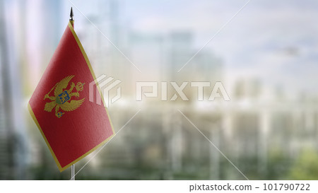 Small flags of the Montenegro on an abstract blurry background 101790722
