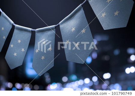 A garland of Federated States Micronesia national flags on an abstract blurred background 101790749