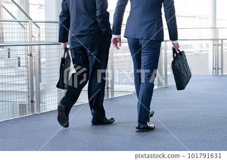 Businessman walking back view 101791631
