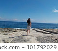 European woman walking towards the sea 101792029