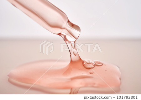 Pipette with a viscous pink cosmetic close-up. 101792801