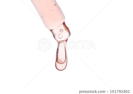 Pipette with a viscous pink cosmetic close-up. 101792802