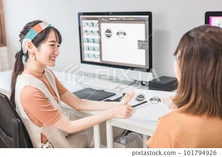 A woman who works as a photo editor, image editor, photo processor, retoucher, and graphic designer 101794926