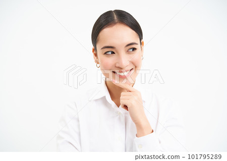 Successful asian woman, business professional, smiling with intrigued face, thinking, looking thoughtful aside, standing over white background Successful asian woman, business professional, smiling with intrigued face, thinking, looking thoughtful aside, standing over white background 101795289