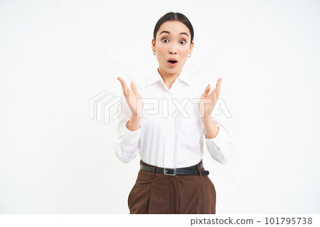 Impressed young female manager, claps hands with amazed face expression, white background 101795738