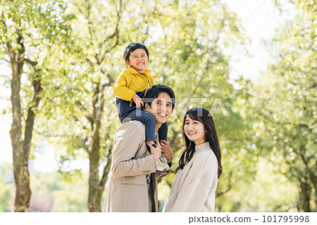 happy family playing in the park happy family playing in the park 101795998