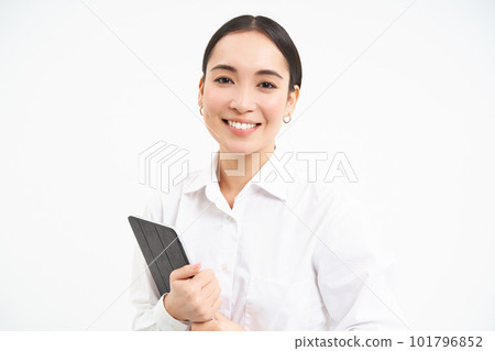 Portrait of businesswoman working on digital tablet, creating diagrams for meeting conference on gadget, standing over white background 101796852