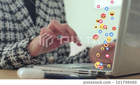 Woman uses laptop computer, types chat messages. 3D emoji, meme icons flying out of device. Woman uses laptop computer, types chat messages. 3D emoji, meme icons flying out of device. 101798480