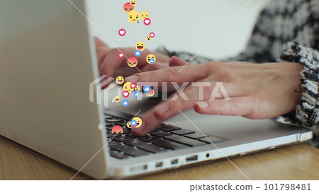 Woman uses laptop computer, types chat messages. 3D emoji, meme icons flying out of device. Woman uses laptop computer, types chat messages. 3D emoji, meme icons flying out of device. 101798481