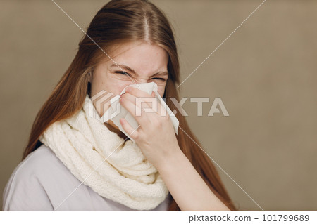 Young woman blowing nose has flu catarrh ill sick disease treatment cold Young woman blowing nose has flu catarrh ill sick disease treatment cold 101799689