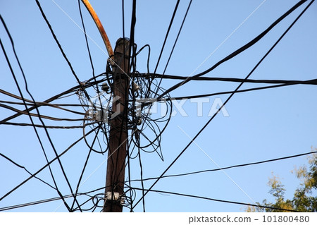 A tangle of electricity and communications cables, television aerials, satellite dishes in Prizren. 101800480