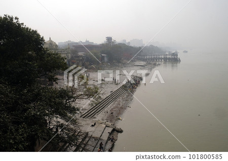 People bathing in river Hooghly under the busy Howrah bridge in Kolkata People bathing in river Hooghly under the busy Howrah bridge in Kolkata 101800585