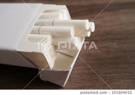 Cigarette in pack, roll tobacco in paper with filter tube, No smoking concept. 101804010