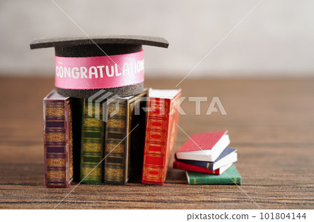 Graduation hat on book with copy space, learning university education concept. Graduation hat on book with copy space, learning university education concept. 101804144
