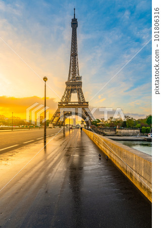 Eiffel tower from Jena Bridge, French: Pont d Iena. Beautiful sunrise after rain in Paris, France. 101806316