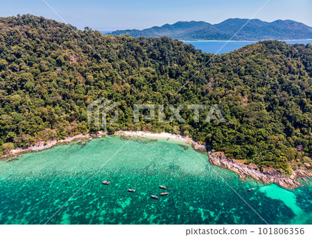 Beautiful Koh lipe island with tropical sea, fishing boat and resort on the beach in summer vacation 101806356