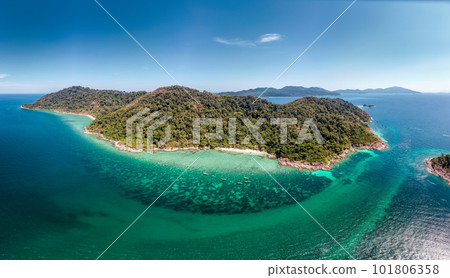 Beautiful Koh lipe island with tropical sea, fishing boat and resort on the beach in summer vacation Beautiful Koh lipe island with tropical sea, fishing boat and resort on the beach in summer vacation 101806358