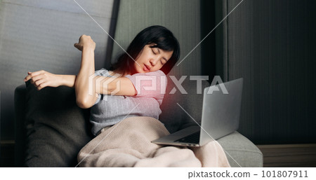 Asian woman has shoulder pain while working on laptop at home. People with body-muscles problem, Healthcare And Medicine. 101807911