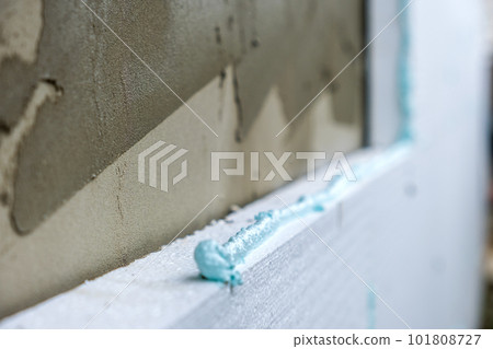 Insulation of facade wall with styrofoam sheets. Polystyrene insulation  boards with glue adhesive Stock Photo by bilanol