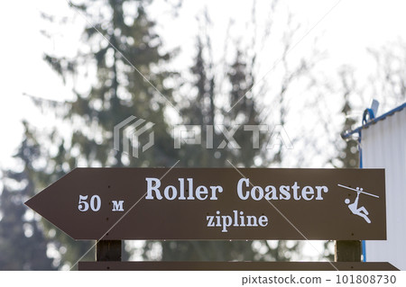 Information sign with words "roller coaster zipline" on it 101808730