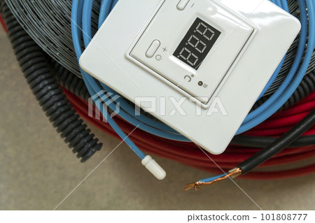 Heating floor system wires, cables and control panel. Renovation and construction concept. Comfort house. 101808777