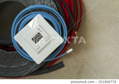 Heating floor system wires, cables and control panel. Renovation and construction concept. Comfort house. 101808778