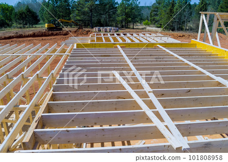 During construction of newly constructed wooden house framing beam supports framework construction layout joists. 101808958